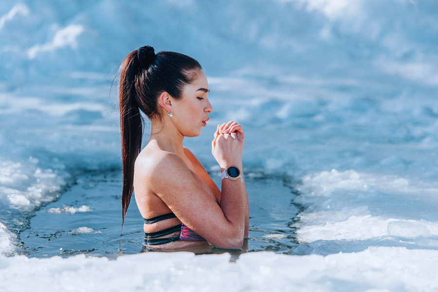 Woman standing in an ice hole