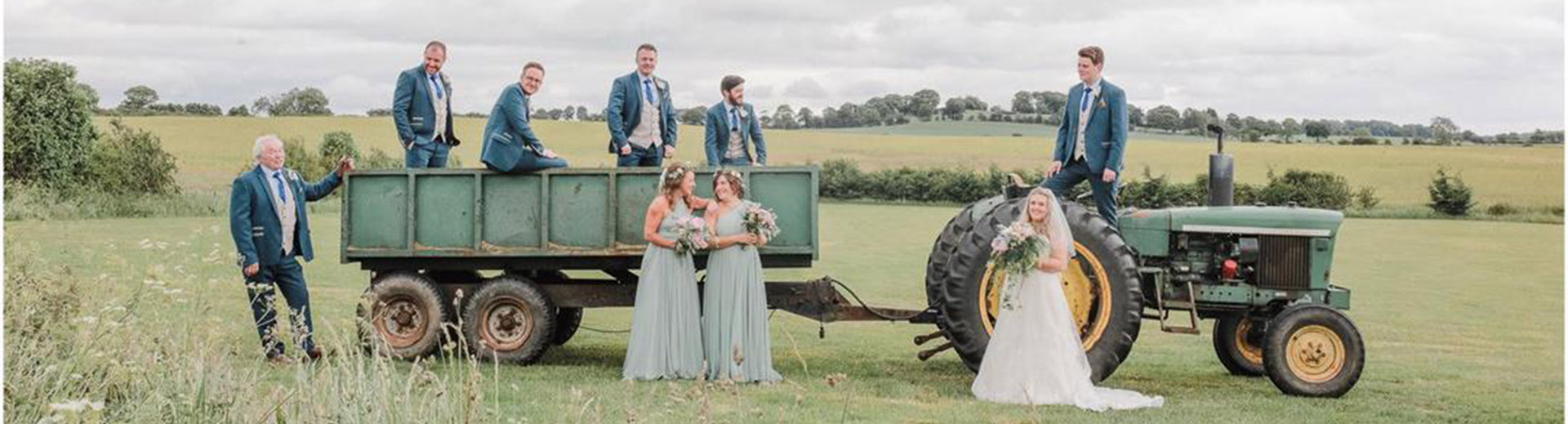 Wedding group on an old tractor and trailer